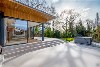 JE Builders worked closely with the clients to build a low maintenance and contemporary terrace using materials from Country Supplies including Dorset Sahara Porcelain Paving, Composite Prime HD Dual Antique, Azpects EasyGrout, Aco Brickslot Drains. 