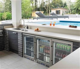 KonigOutdoor kitchen with Dekton Bromo  stone door and drawer fronts and Dekton Danae  built up worktops